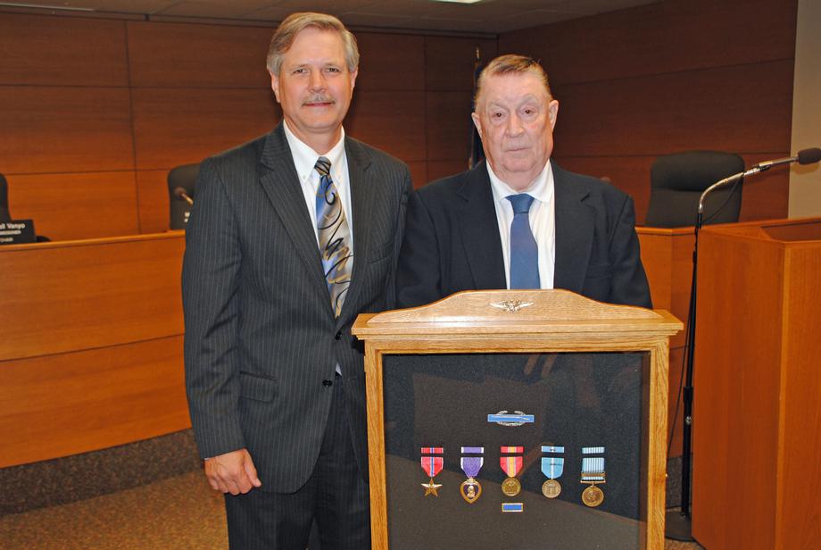 Service Medals to Salsman-August 2011-Senator John Hoeven presents U.S. Army veteran Robert Salsman the military service medals he earned during the Korean War.